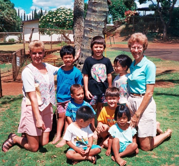 Peggy (right) her instructional assistant and preschool class in Oahu, Hawaii, 1996 (Yes, people really did go barefoot at school sometimes, or at least used to!)