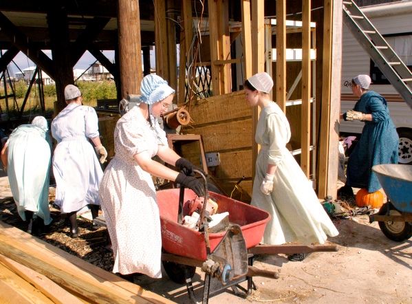 Mennonite sisters from Maryland go after Hurricane Katrina relief with all sorts of tools. Photo by Marvin Nauman, from the FEMA Photo Library,public domain via Wikimedia Commons